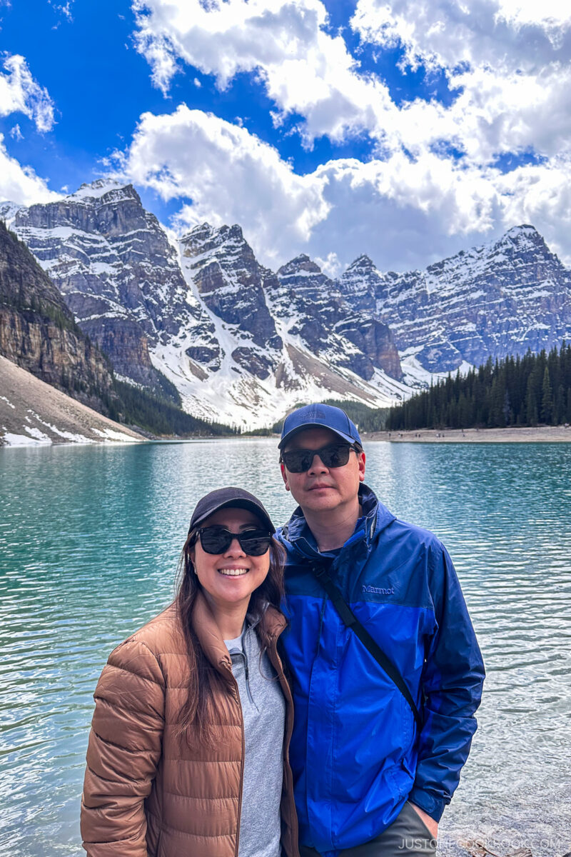 two people standing in front of Moraine Lake