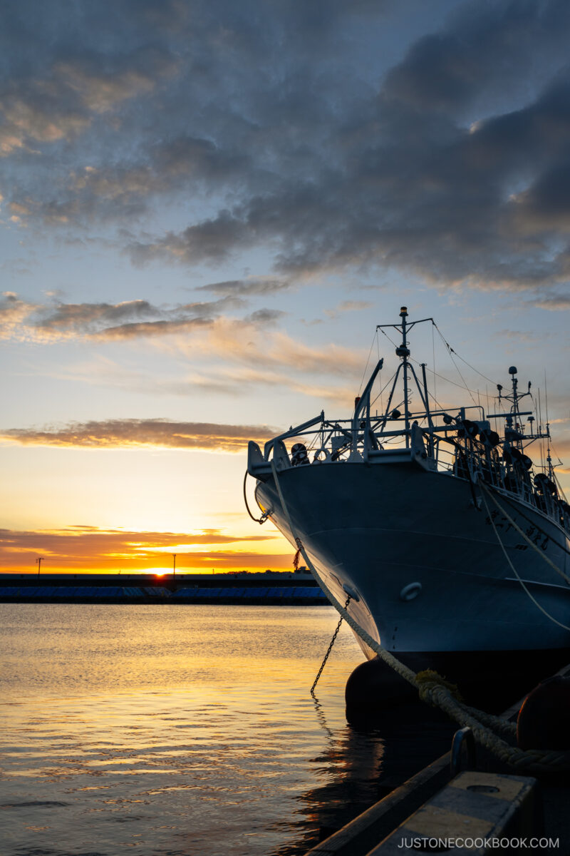 Pier with a boat at sunrise