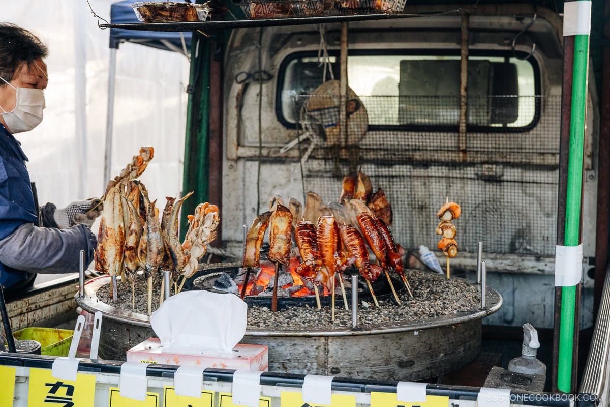 Charcoal fire with seafood grilling on sticks
