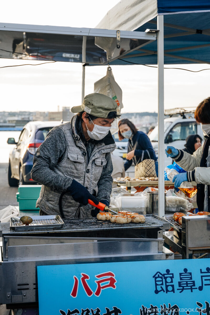 Chef grilling onigiri with sea urchin
