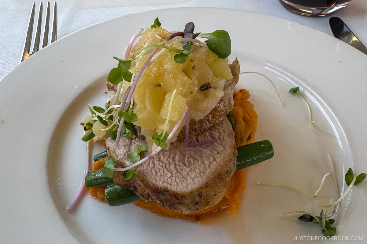 a pork dish on a white plate