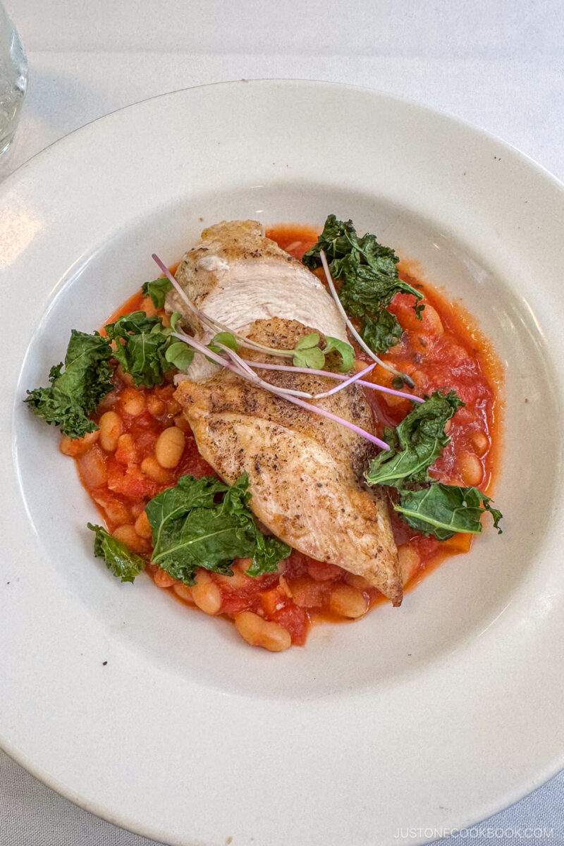 a chicken dish on a white plate