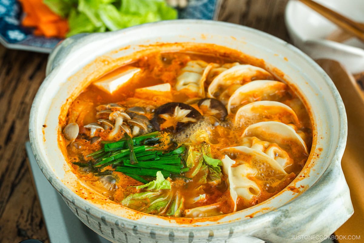 Kimchi Gyoza Nabe served in donabe (Japanese earthenware pot).