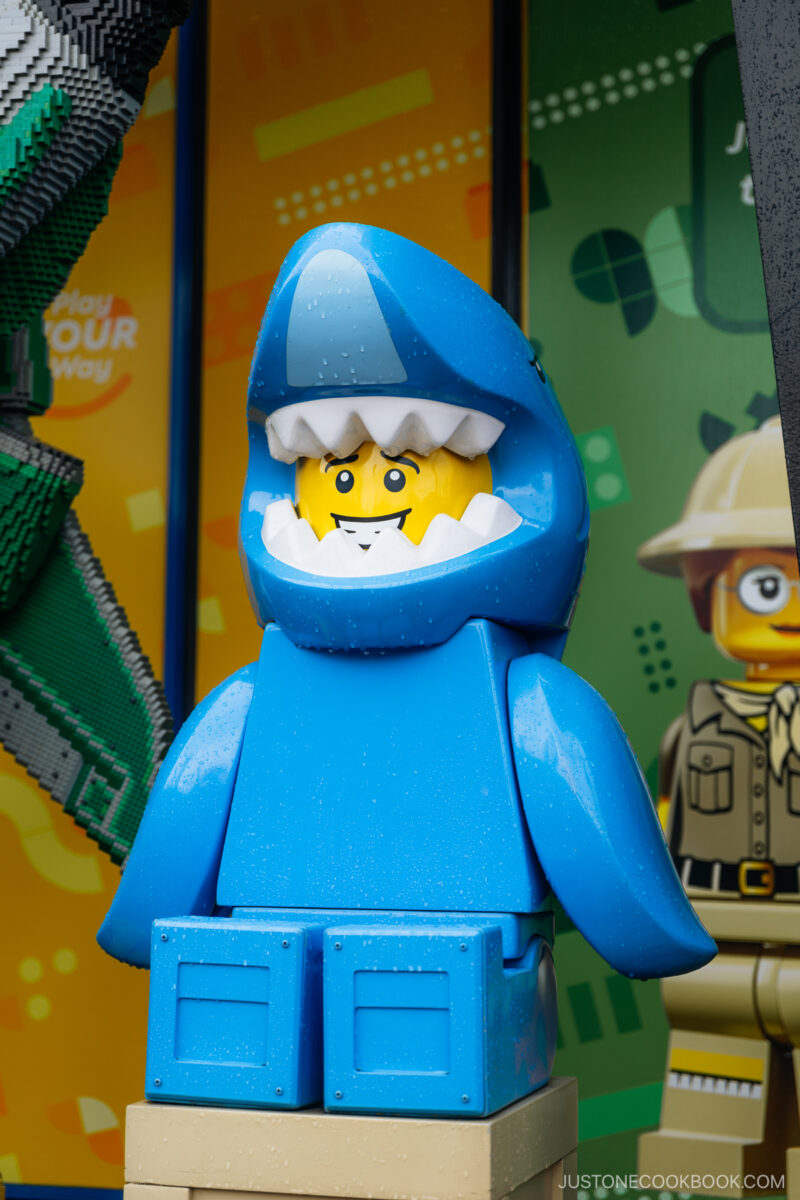 Lego character dressed in a shark costume