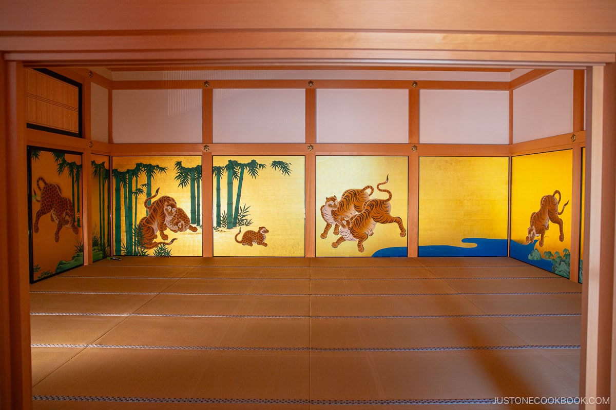 Traditional interior design of Nagoya castle with golden walls and painted tigers and bamboo