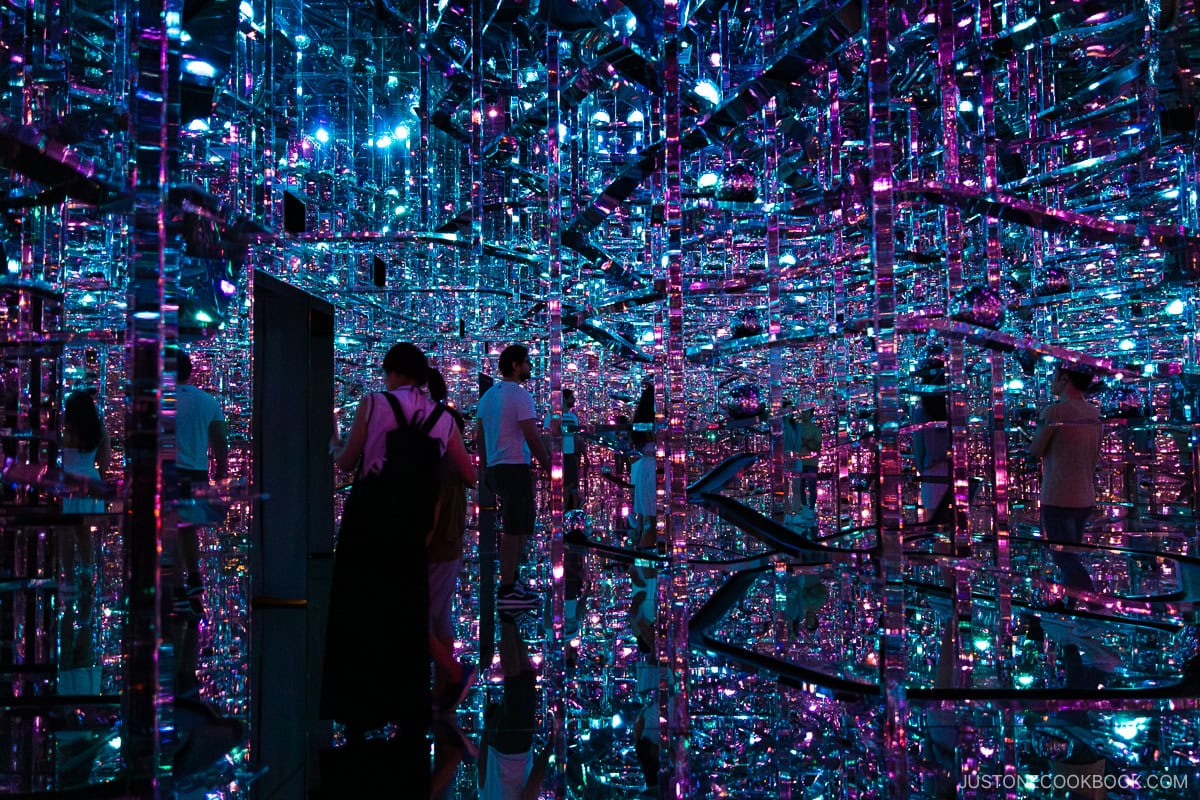 Room with LED lamps and mirrored balls rolling down ramps