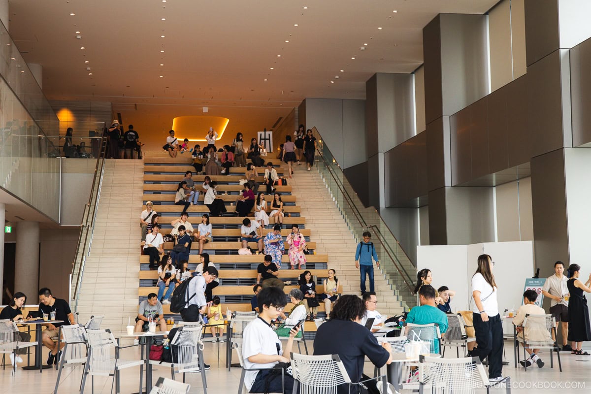 Wooden steps and seating area inside Azabudai Hills Sky Lounge