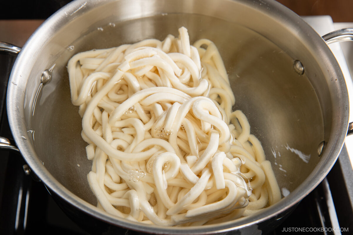 Add the frozen udon noodles to boiling water.