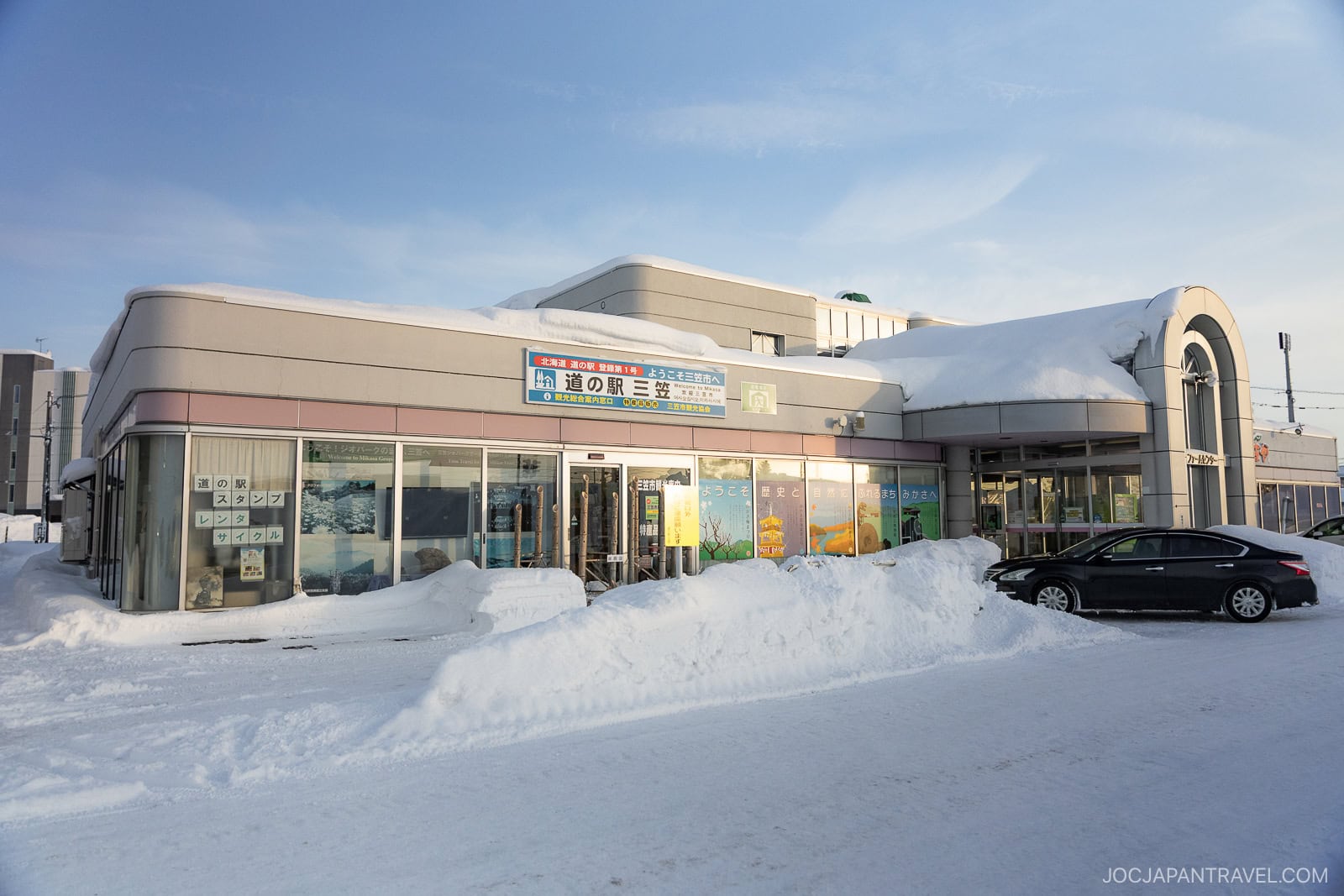 Roadside station building covered in snow