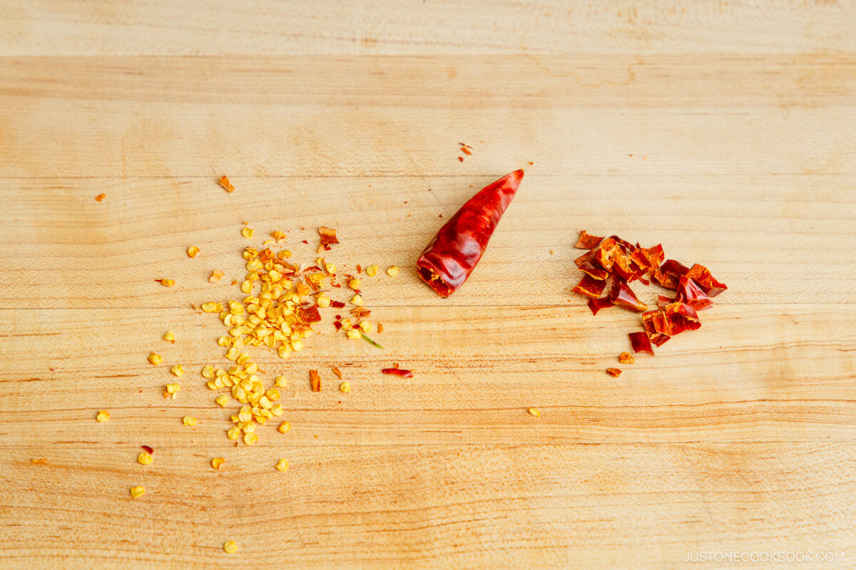 Separate seeds from the dry red chilis.