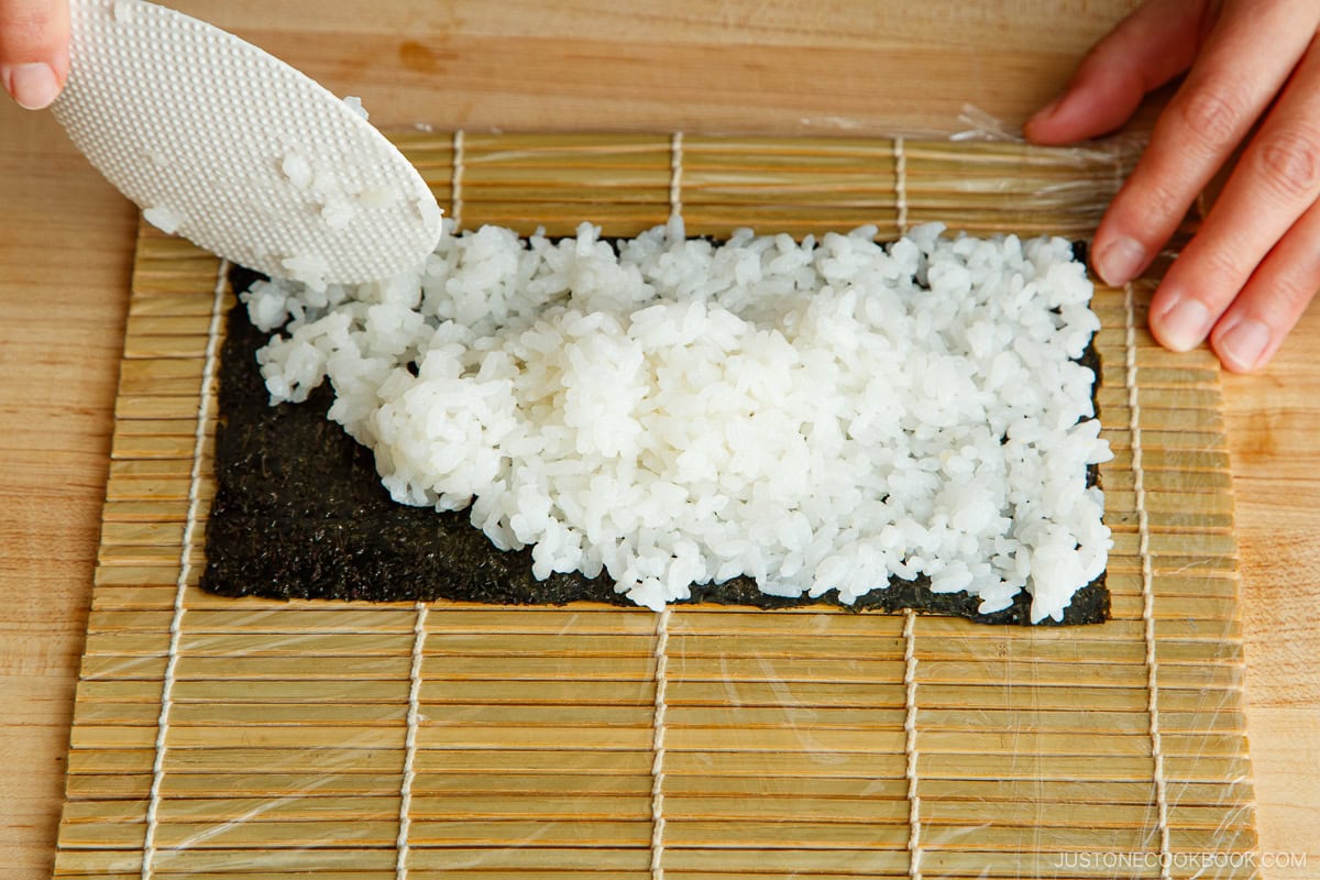 Put the sushi rice on nori sheet.