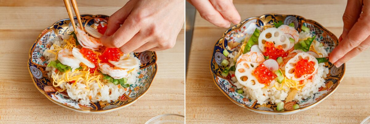 Hands arranging sliced shrimp, lotus root, and red fish roe on a decorative bowl of sushi rice for Quick & Easy Chirashi Sushi, garnished with shredded egg and vegetables, atop a wooden surface.