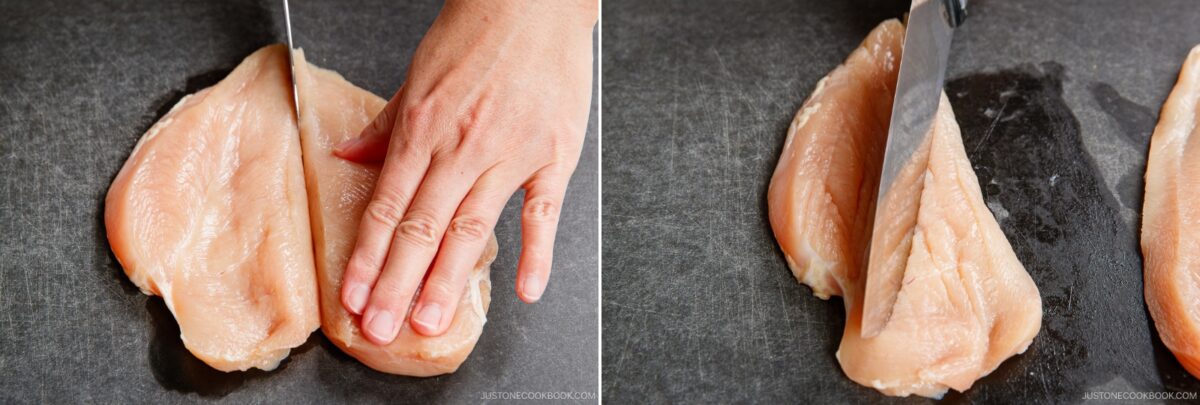 A hand slices raw chicken breasts in half horizontally on a dark cutting board, creating thinner cutlets perfect for making chicken nanban.
